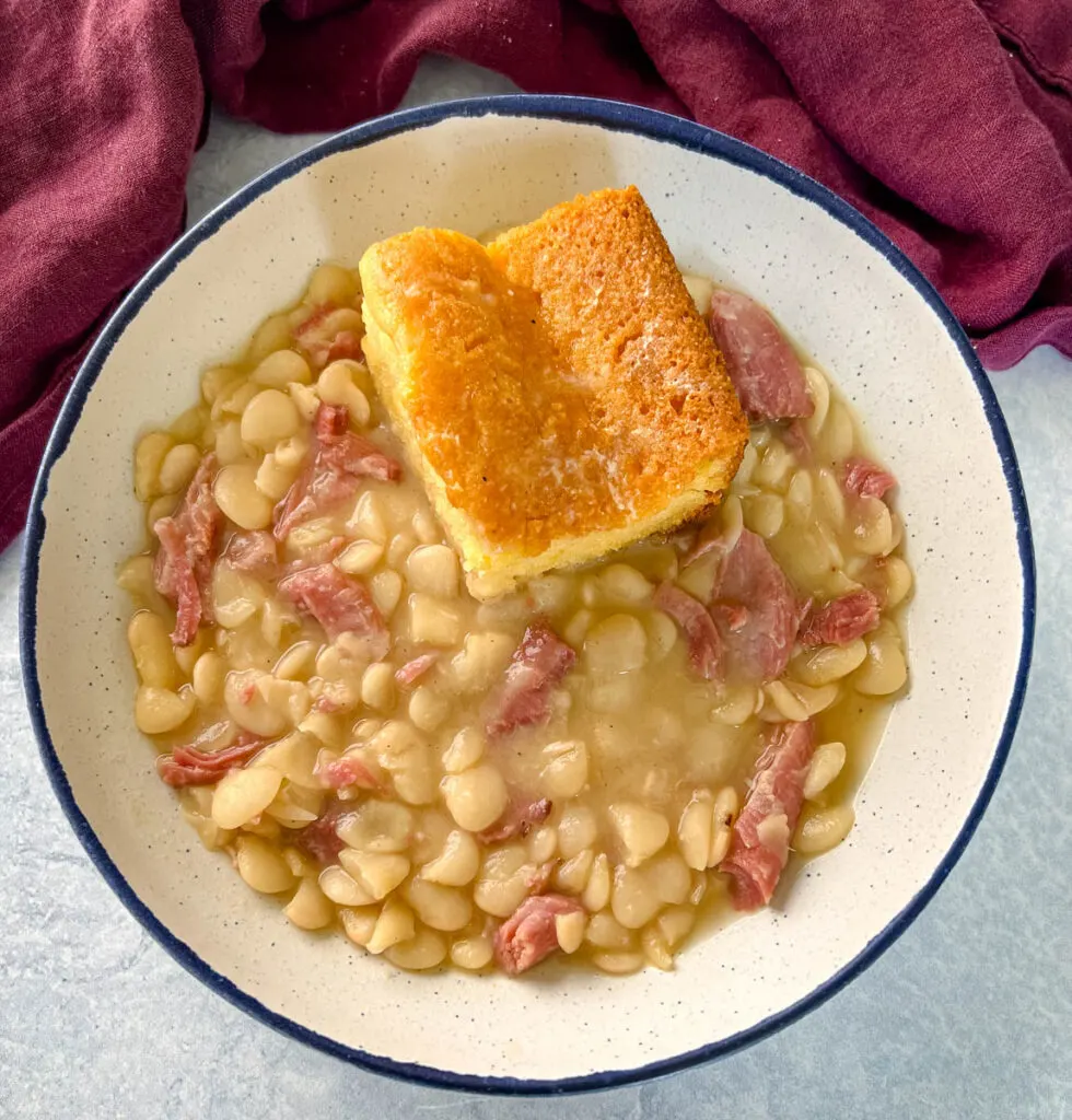 Southern butter lima beans in a bowl with cornbread