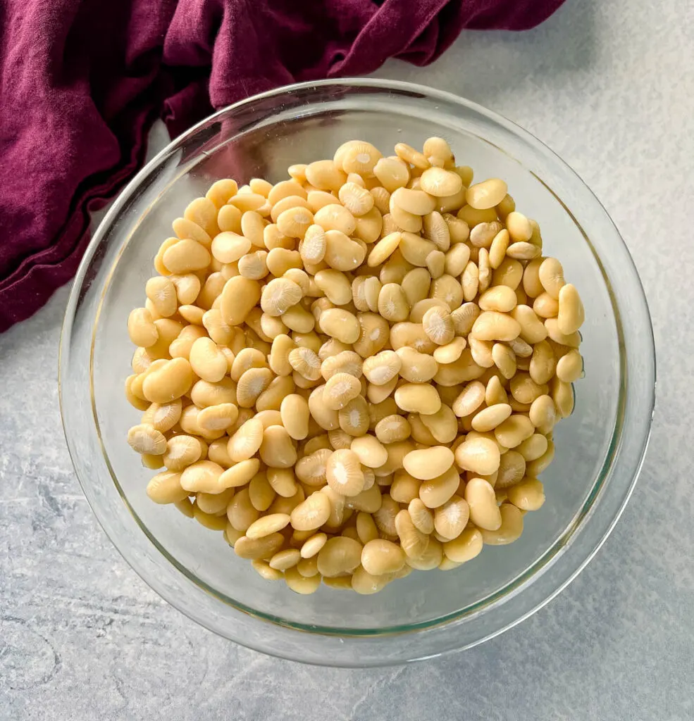 dried lima beans in a glass bowl