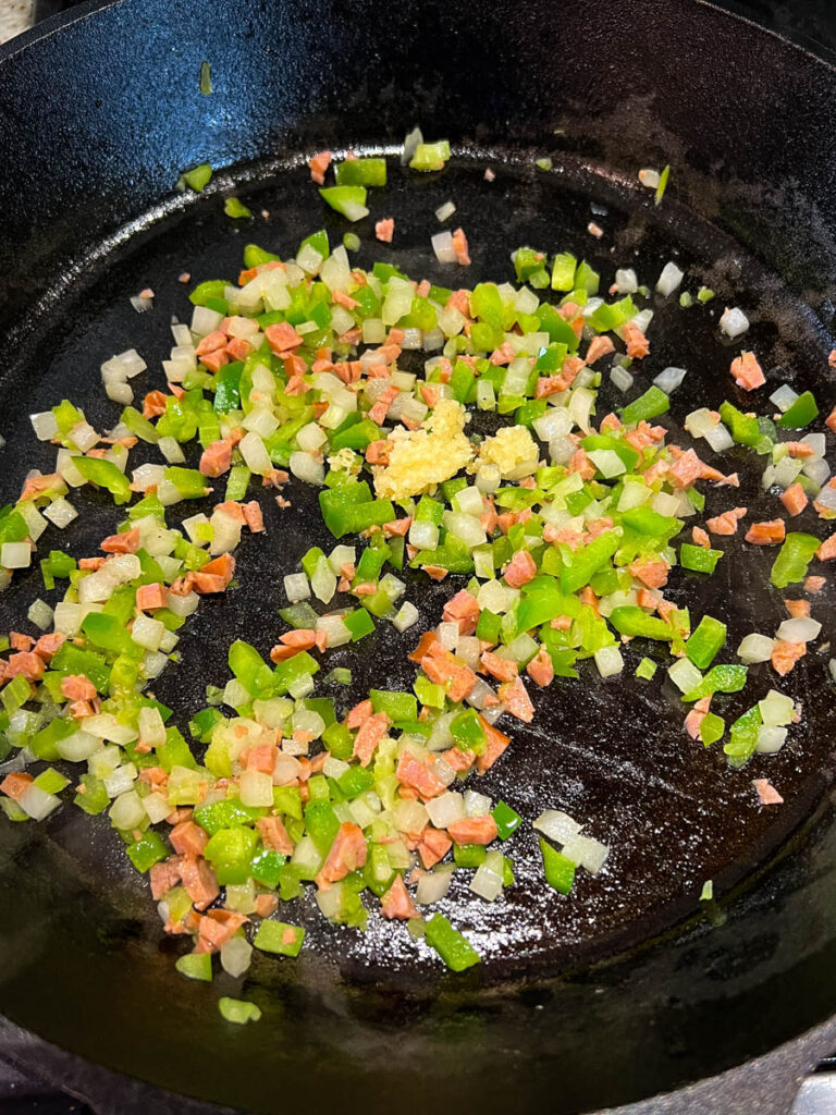 sauteed vegetables in a cast iron skillet