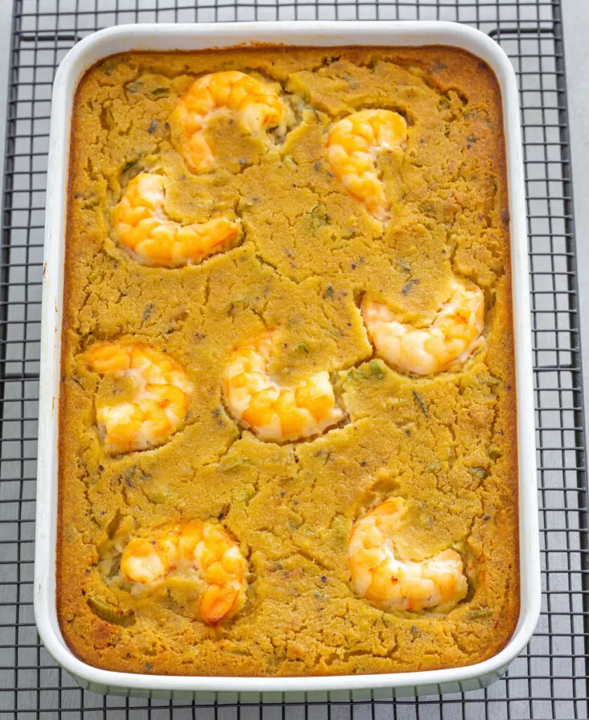 seafood cornbread dressing with shrimp in a baking dish