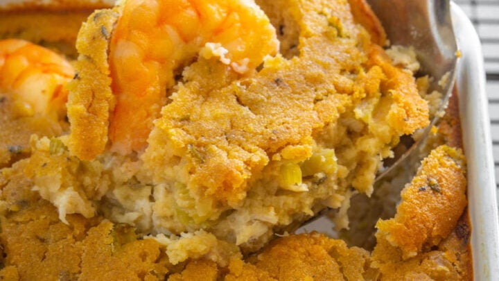 a large spoonful of seafood cornbread dressing with crab and shrimp
