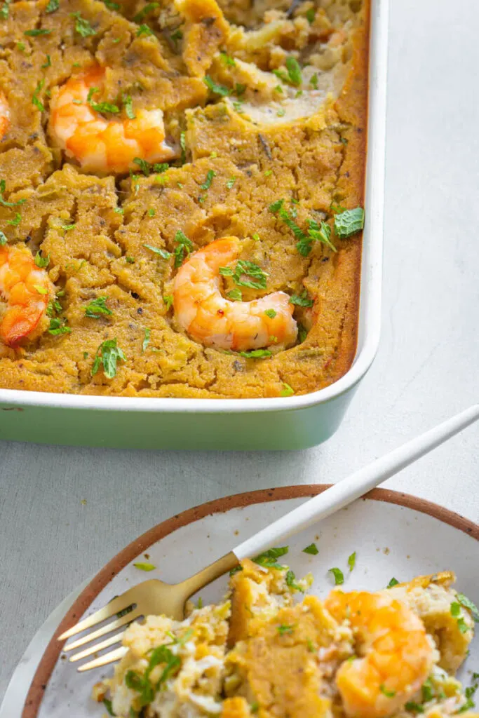 seafood cornbread dressing with shrimp in a baking dish
