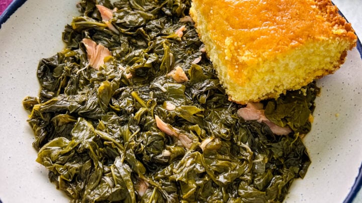 Southern turnip greens in a bowl with a slice of cornbread