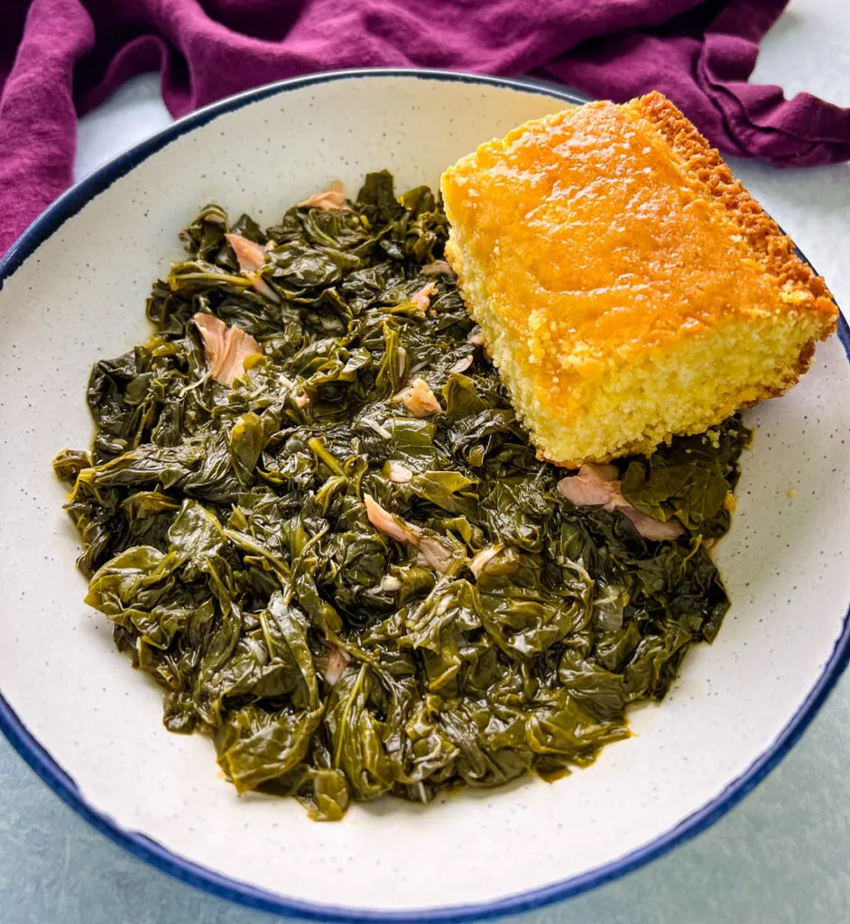 Southern turnip greens in a bowl with a slice of cornbread