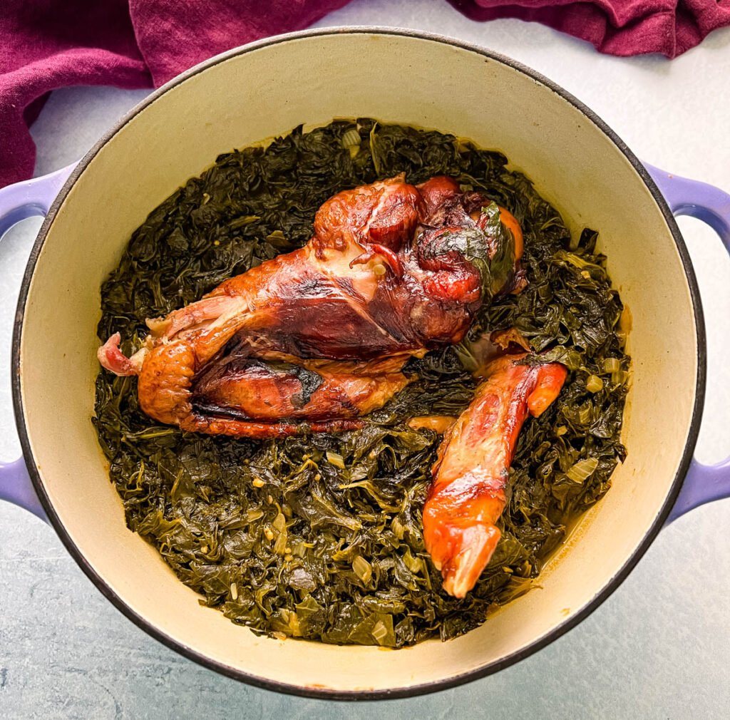 cooked turnip greens and smoked turkey in a Dutch oven