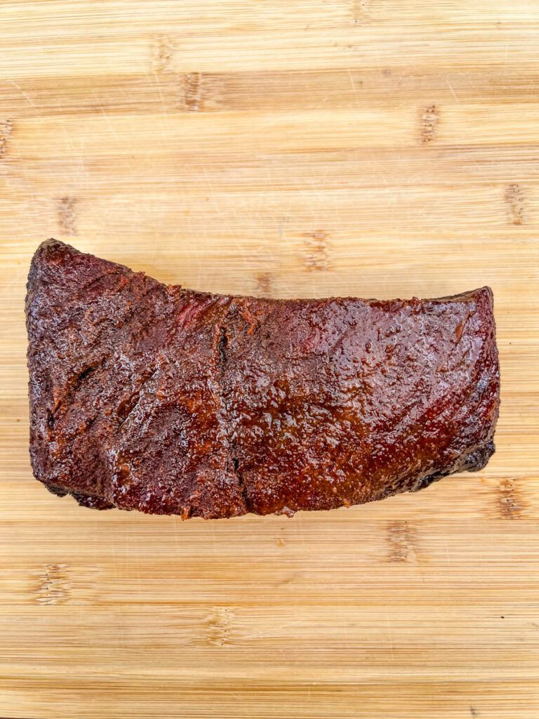 Traeger smoked brisket on a bamboo cutting board