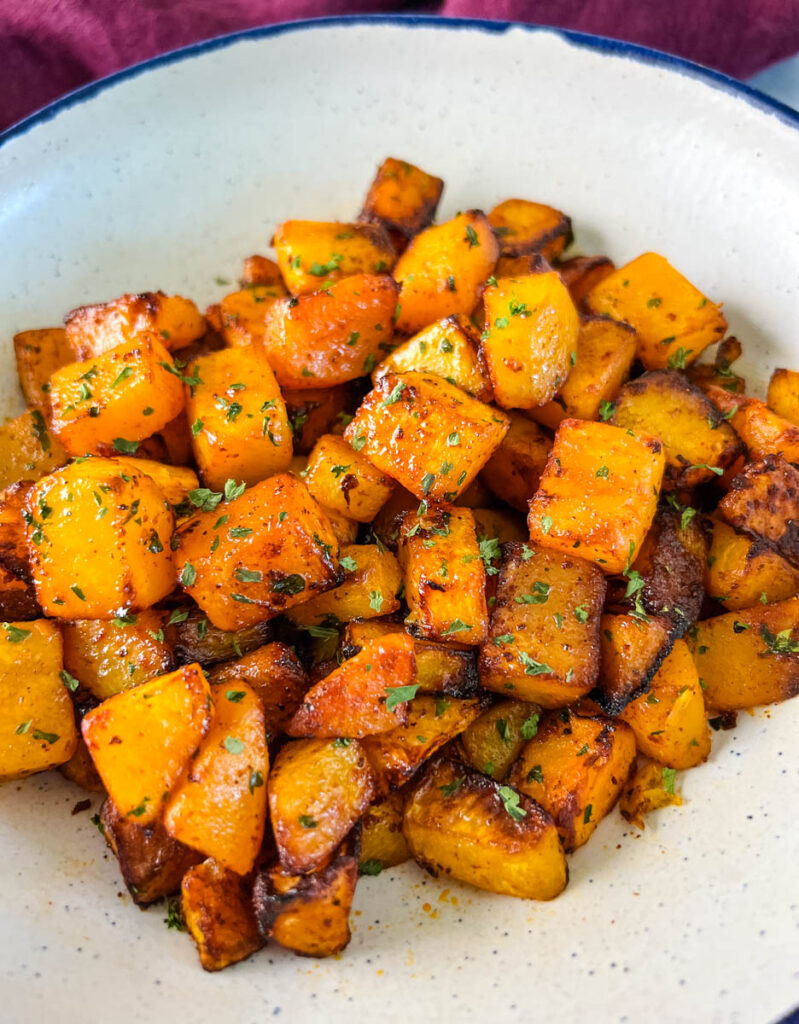 air fryer butternut squash in a white bowl