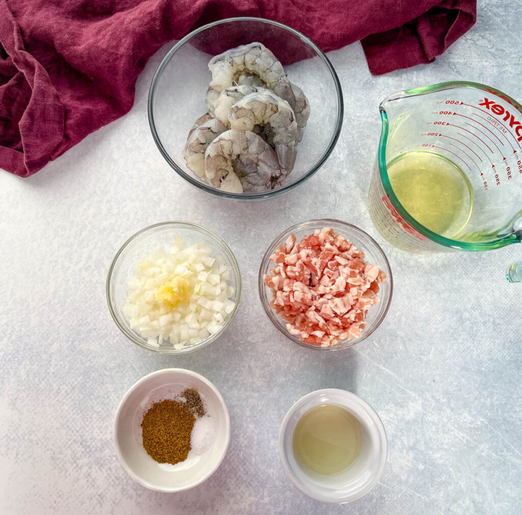 raw shrimp, bacon, broth, Cajun seasoning, onions, and lemon juice in separate bowls