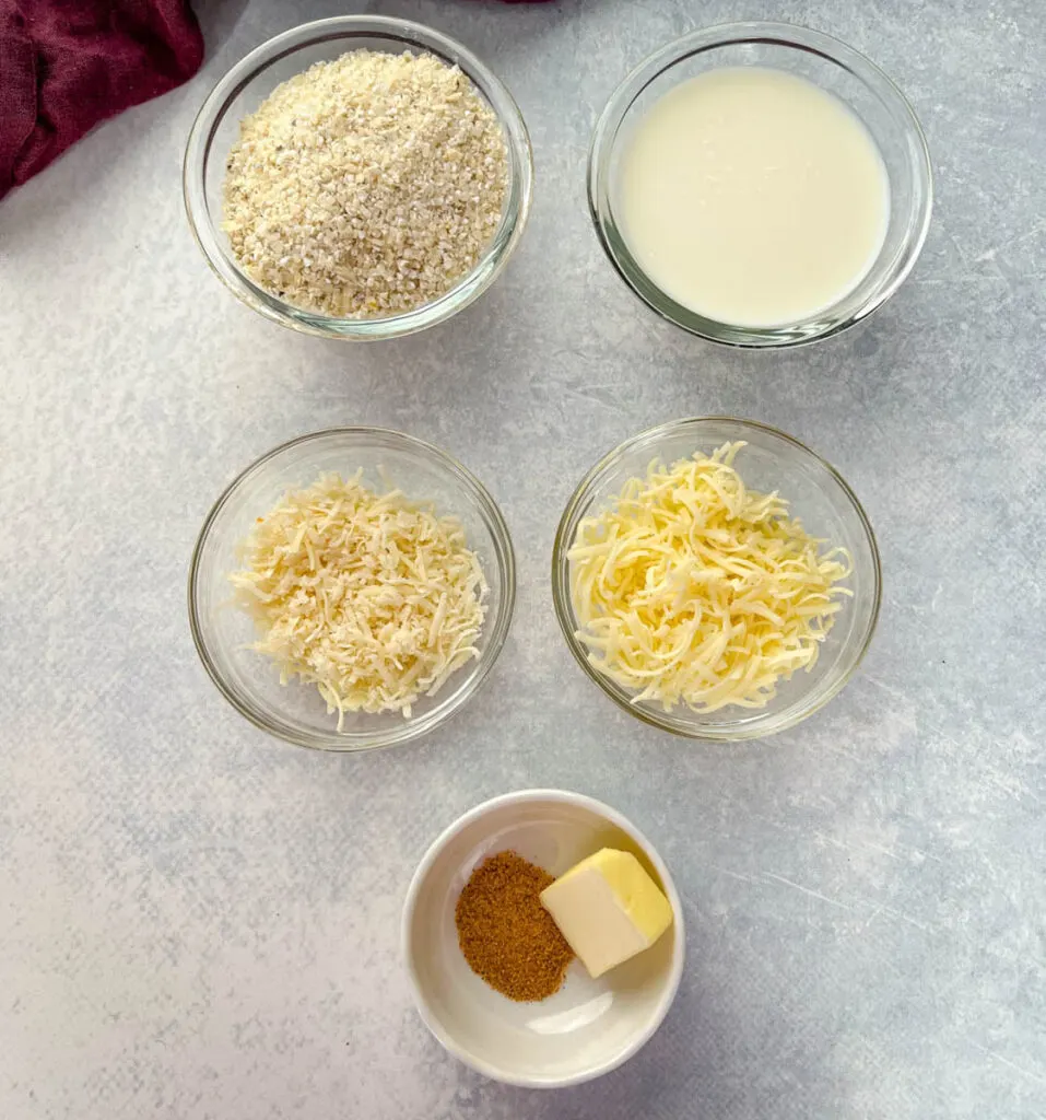 grits, milk, butter, cheese, and Cajun seasoning in separate bowls