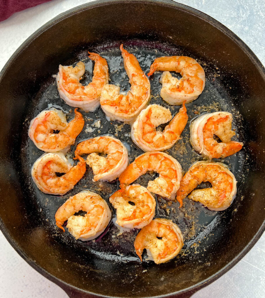 cooked shrimp in a cast iron skillet