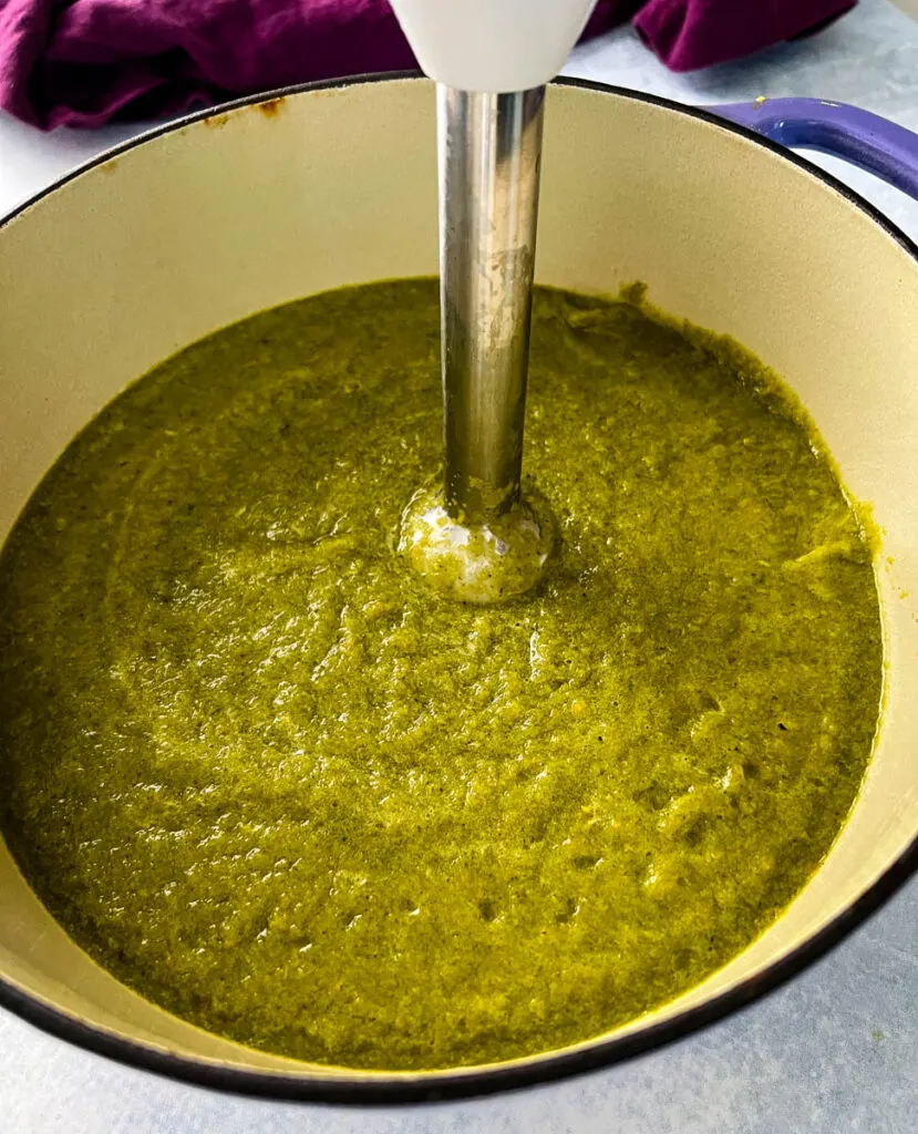 roasted poblano soup in a Dutch oven with an immersion blender