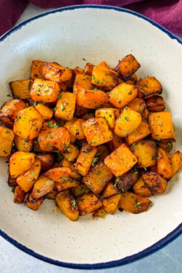 air fryer butternut squash in a white bowl