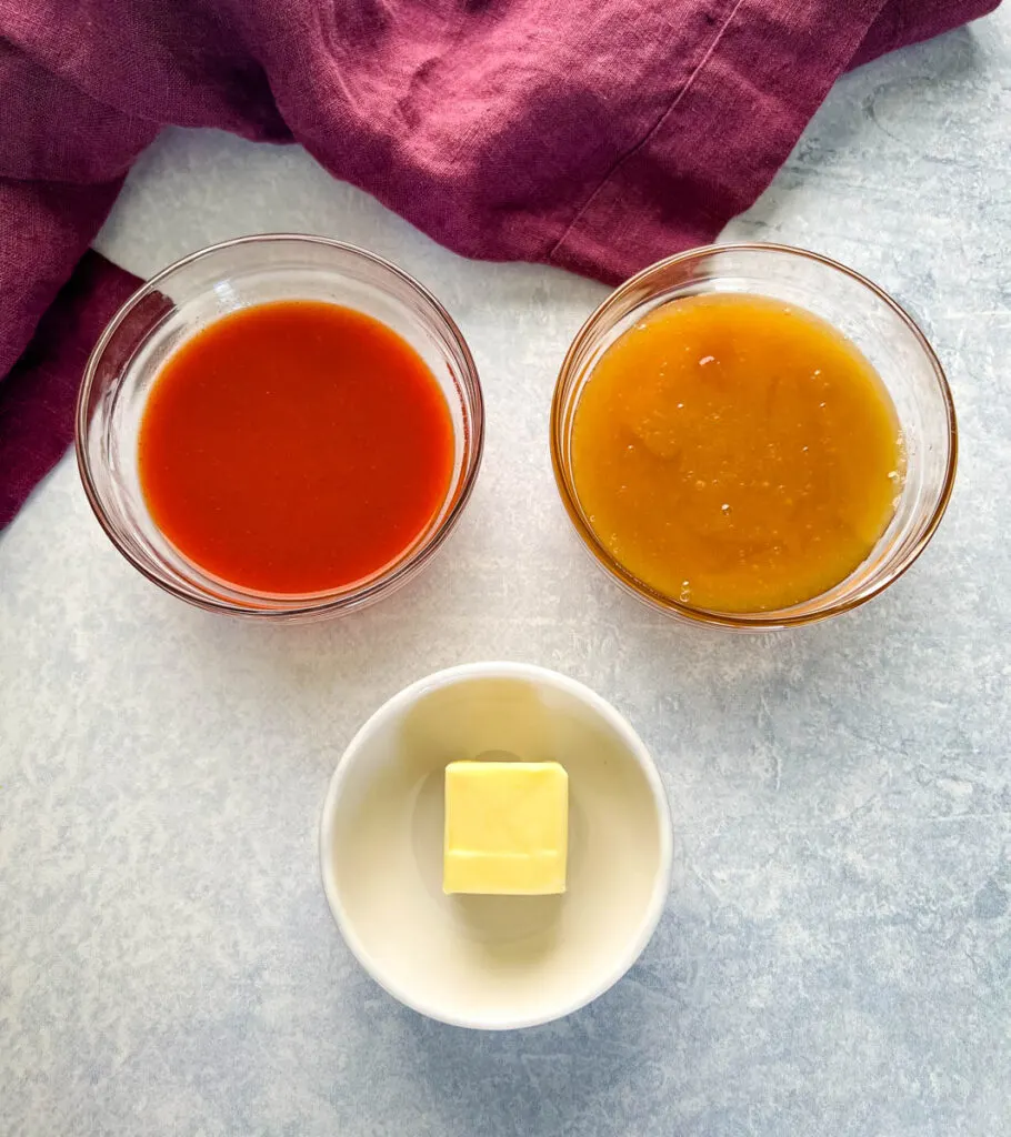 butter, honey, and hot sauce in separate bowls