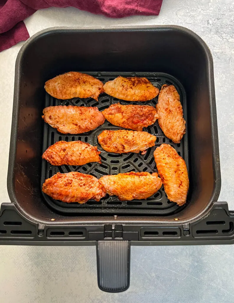 raw seasoned chicken wings in an air fryer