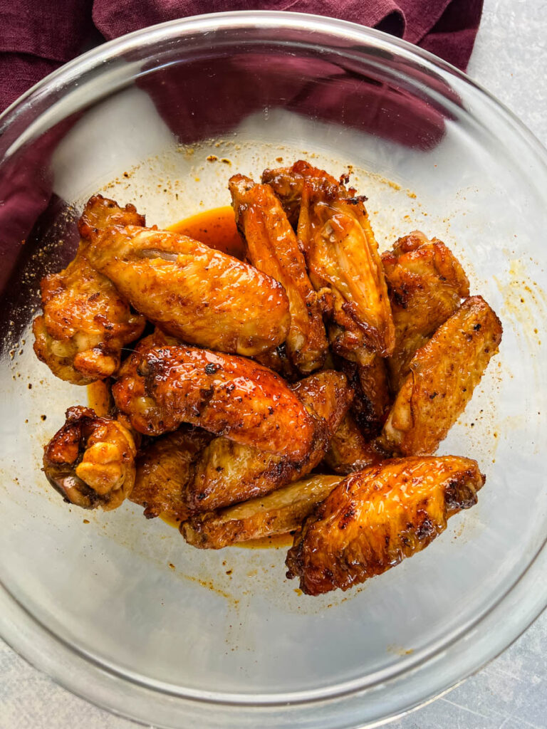 honey hot wings in a glass bowl