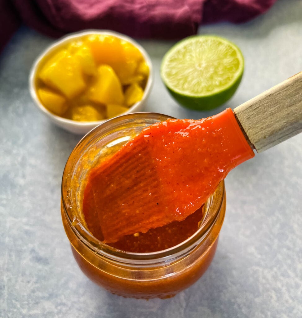 a cooking brush filled with mango habanero sauce