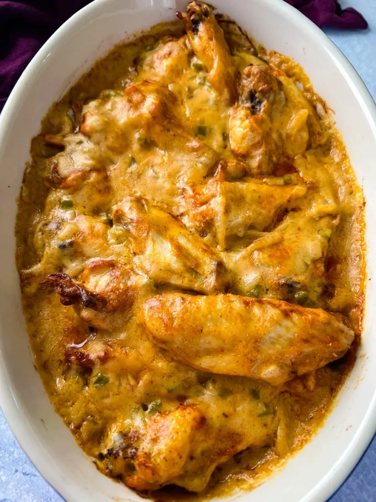 smothered chicken wings in a baking dish