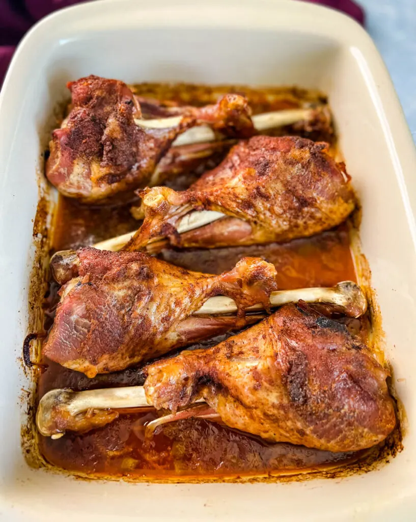 baked turkey legs in a baking dish