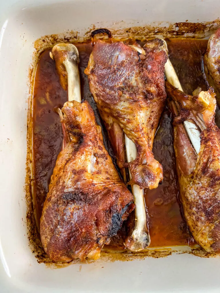 baked turkey legs in a baking dish