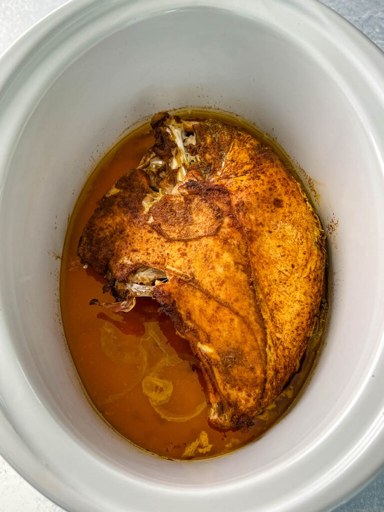 cooked bone-in turkey breast in Crockpot slow cooker