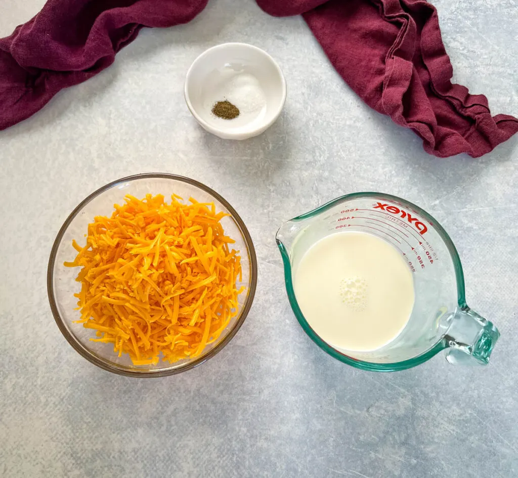 shredded cheddar cheese, half and half, and salt and pepper in separate bowls