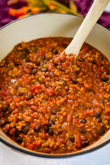 ground chicken chili with beans in a Dutch oven