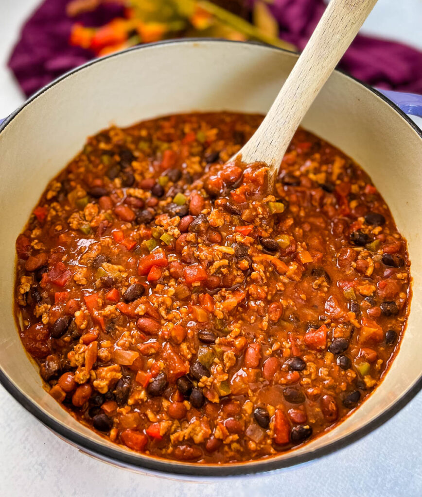 ground chicken chili with beans in a Dutch oven
