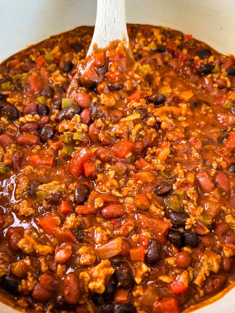 ground chicken chili with beans in a Dutch oven
