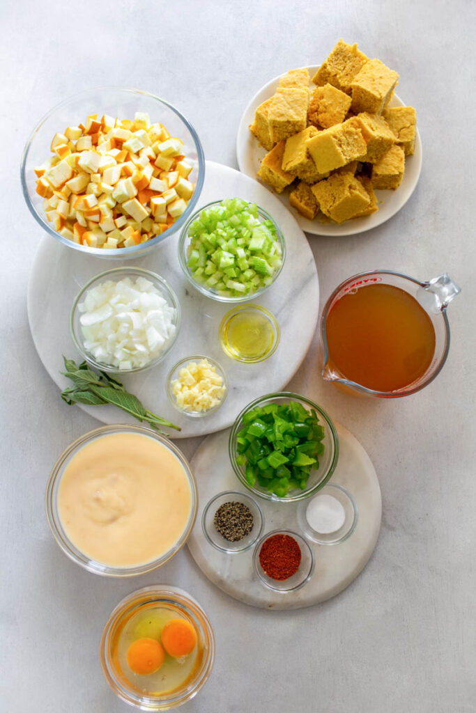 fresh squash, green peppers celery, onions, cream of chicken soup, broth, and spices in separate bowls