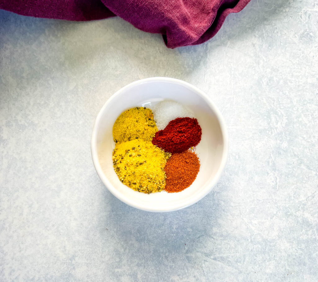 hot lemon pepper spices in a white bowl