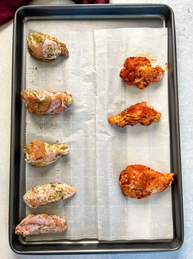raw naked chicken wings on sheet pan