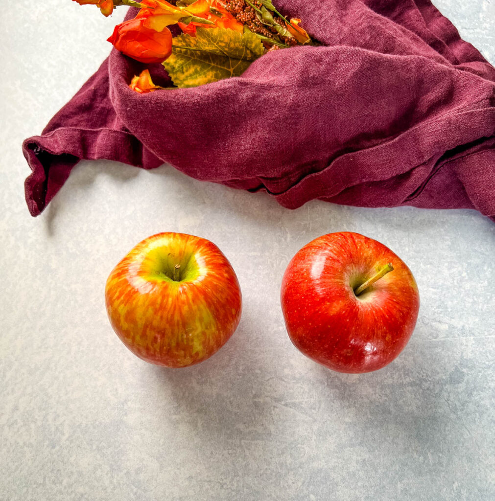 gala and honeycrisp apples on a flat surface