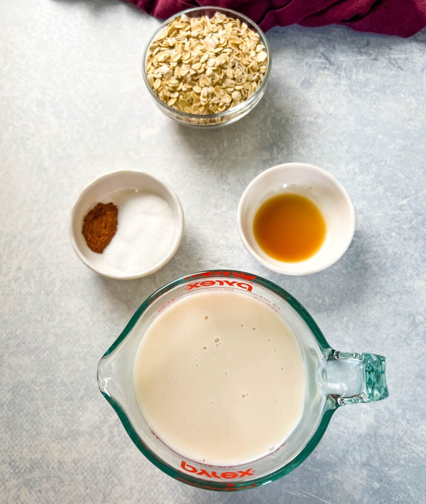 rolled oats, milk, sweetener, cinnamon, and vanilla in separate bowls