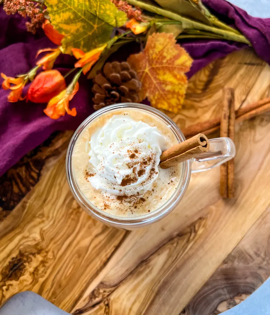 sugar free pumpkin spice latte in a mug with whipped cream and cinnamon