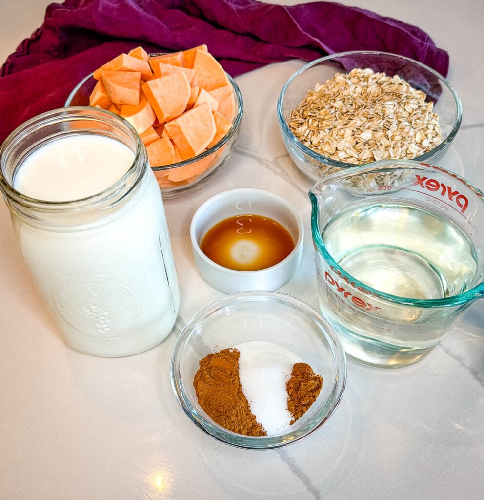 rolled oats, sweet potatoes, vanilla extract, and spices in separate bowls