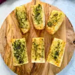 air fryer garlic bread on a wooden cutting board