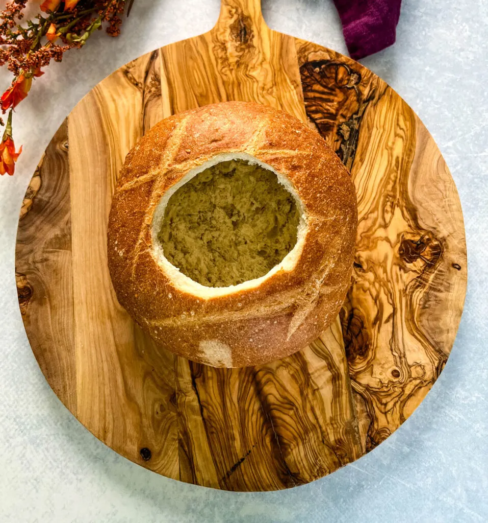 sourdough bread loaf on a wooden cutting board