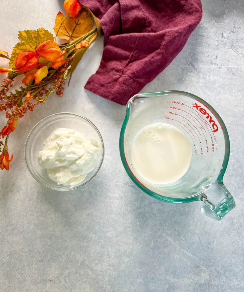 plain Greek yogurt and half and half in glass bowls