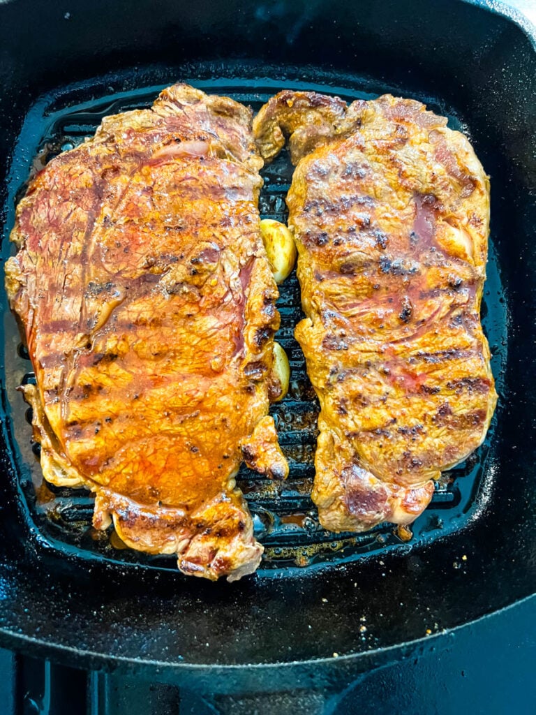 lemon pepper steak in a cast iron skillet
