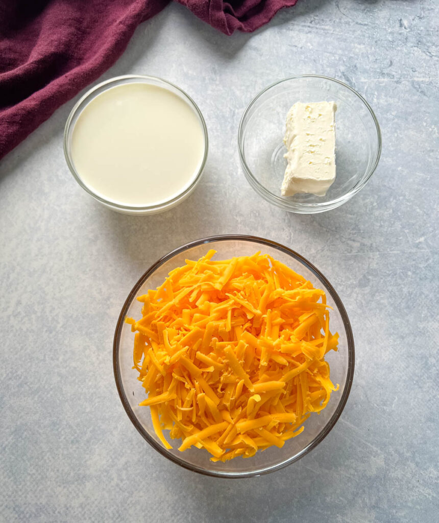 half and half, cream cheese, and shredded cheddar in glass bowls
