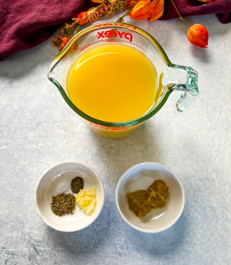 chicken broth and spices in separate bowls