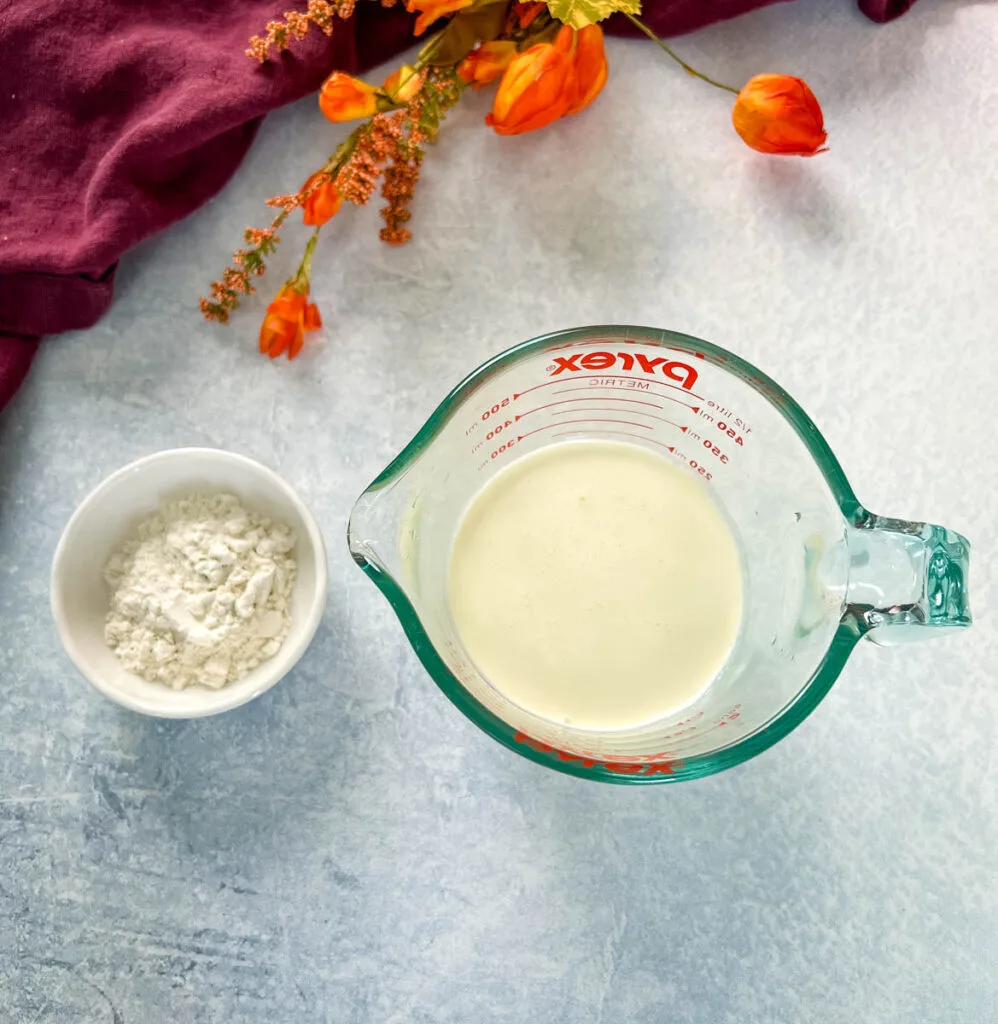 heavy cream and flour in separate bowls