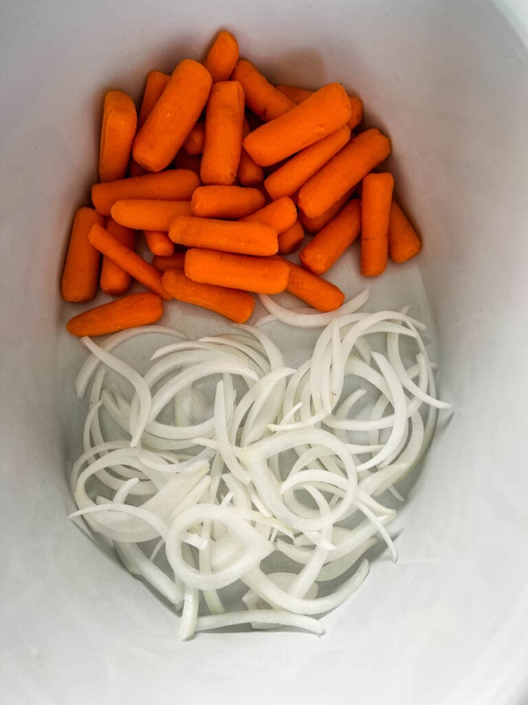 carrots and onions in a Crockpot slow cooker