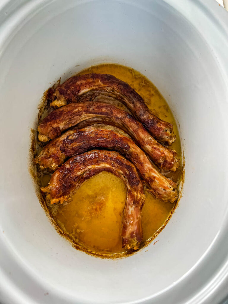 cooked turkey necks in a Crockpot slow cooker