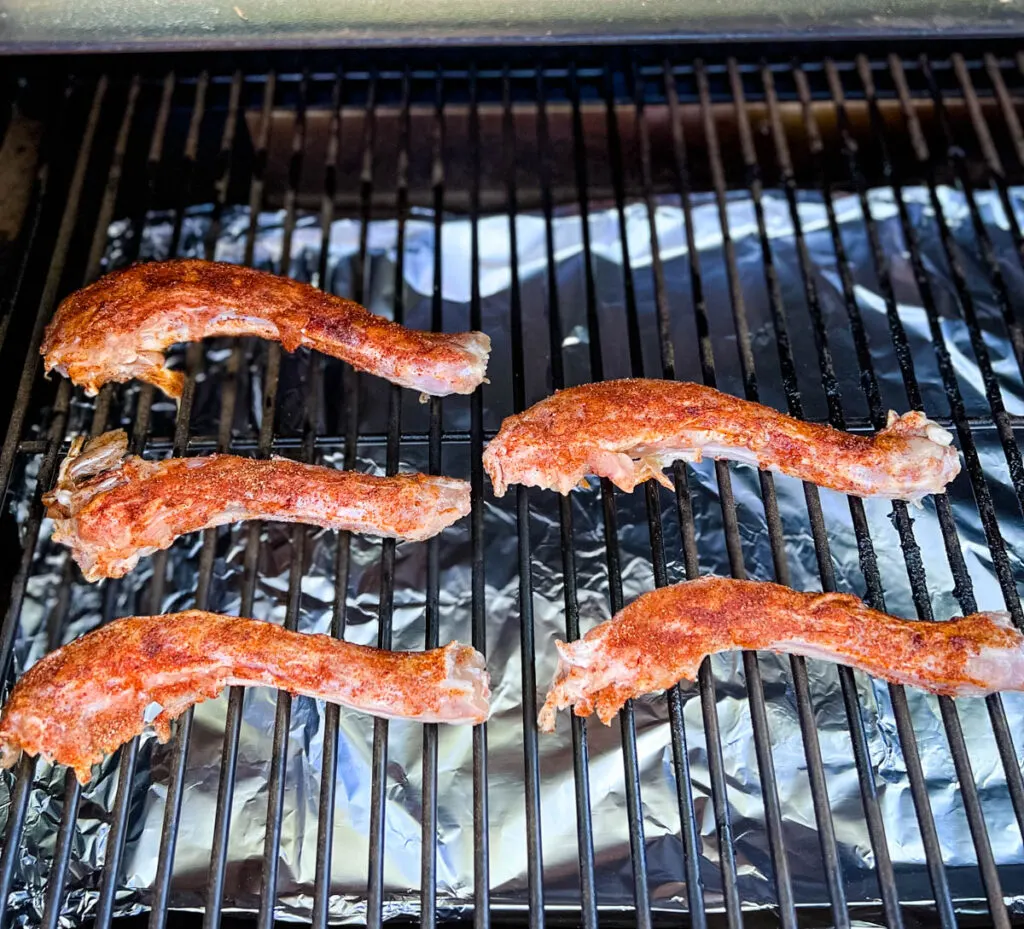 raw turkey necks on a smoker