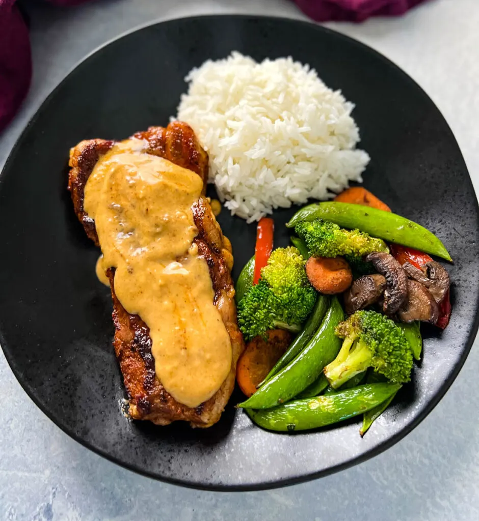 smothered steak with gravy and rice and vegetables
