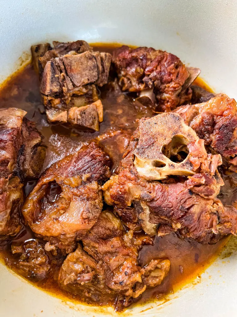 neck bones in a Dutch oven pot