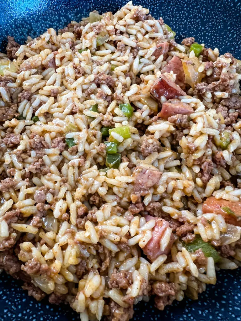 Cajun dirty rice in a cast iron skillet