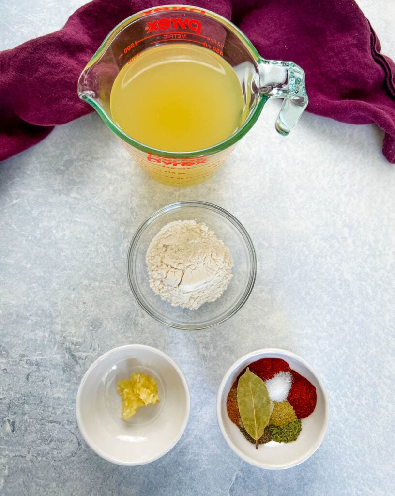 broth, flour, spices, and garlic in separate bowls