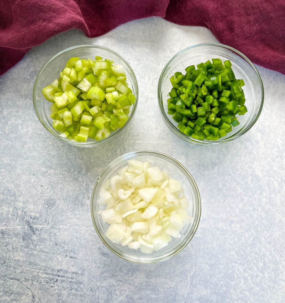 chopped celery, green peppers, and onions in separate bowls
